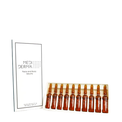 Set of amber glass ampoules with a white box labeled 'MEDI DERMIK' on a white background