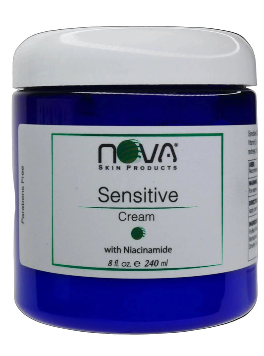 Blue jar of Nova Sensitive Cream with a white lid on a white background