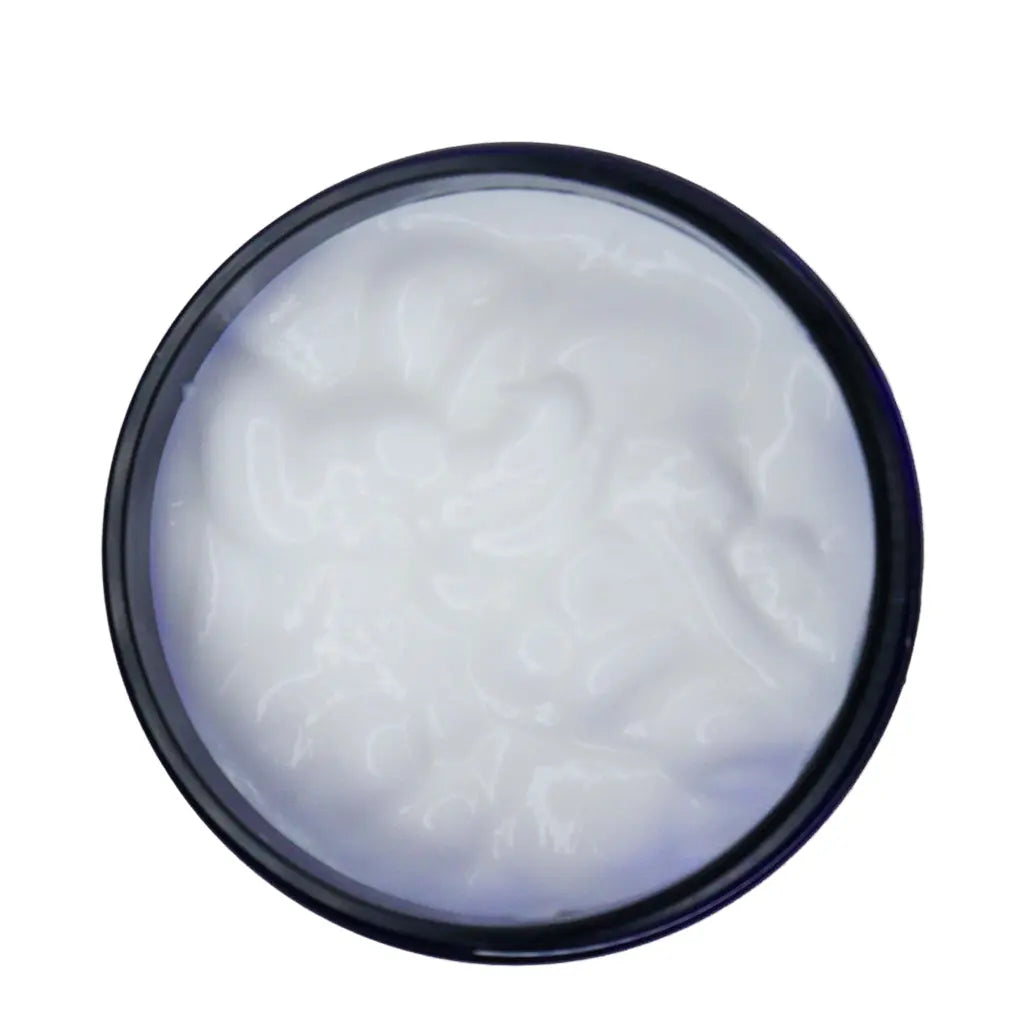 White cream in a blue container on a white background